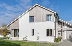 Haus mit Teilverbretterung in Silvershine-Look